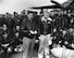 Group of Airman stand next to an aircraft