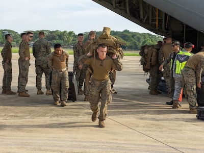 U.S. Marines with 2nd Battalion, 1st Marine Regiment, Marine Rotational Force – Darwin 25.3 unload cargo from a U.S. Air Force C-130J.