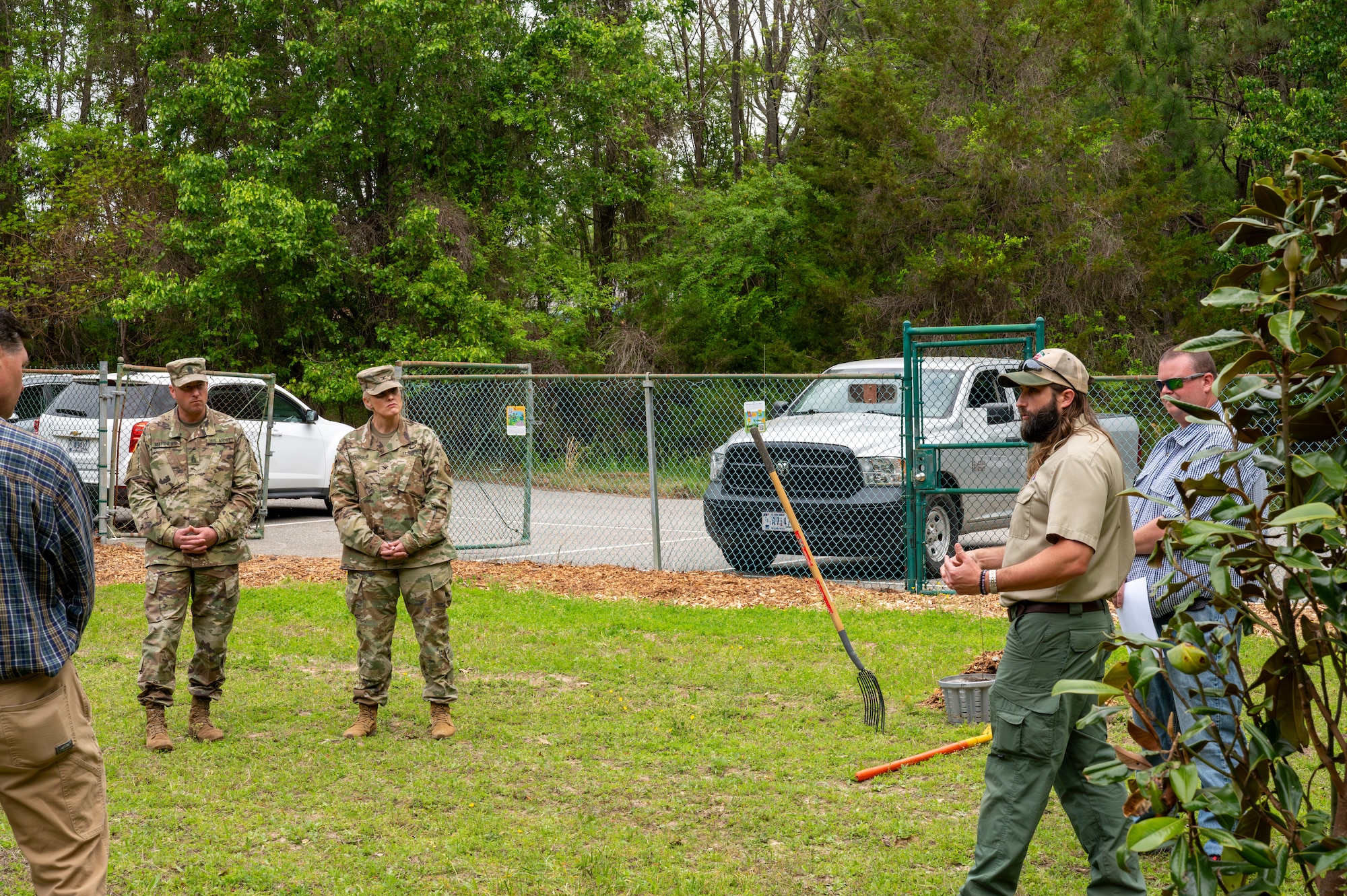 Army Command Sgt. Maj. Jarred Matthews and Col. Laura Hutchinson listen as the Arbor Day Foundation representative discusses the importance of tree conservation and the “Tree City USA” program at Joint Base Langley-Eustis