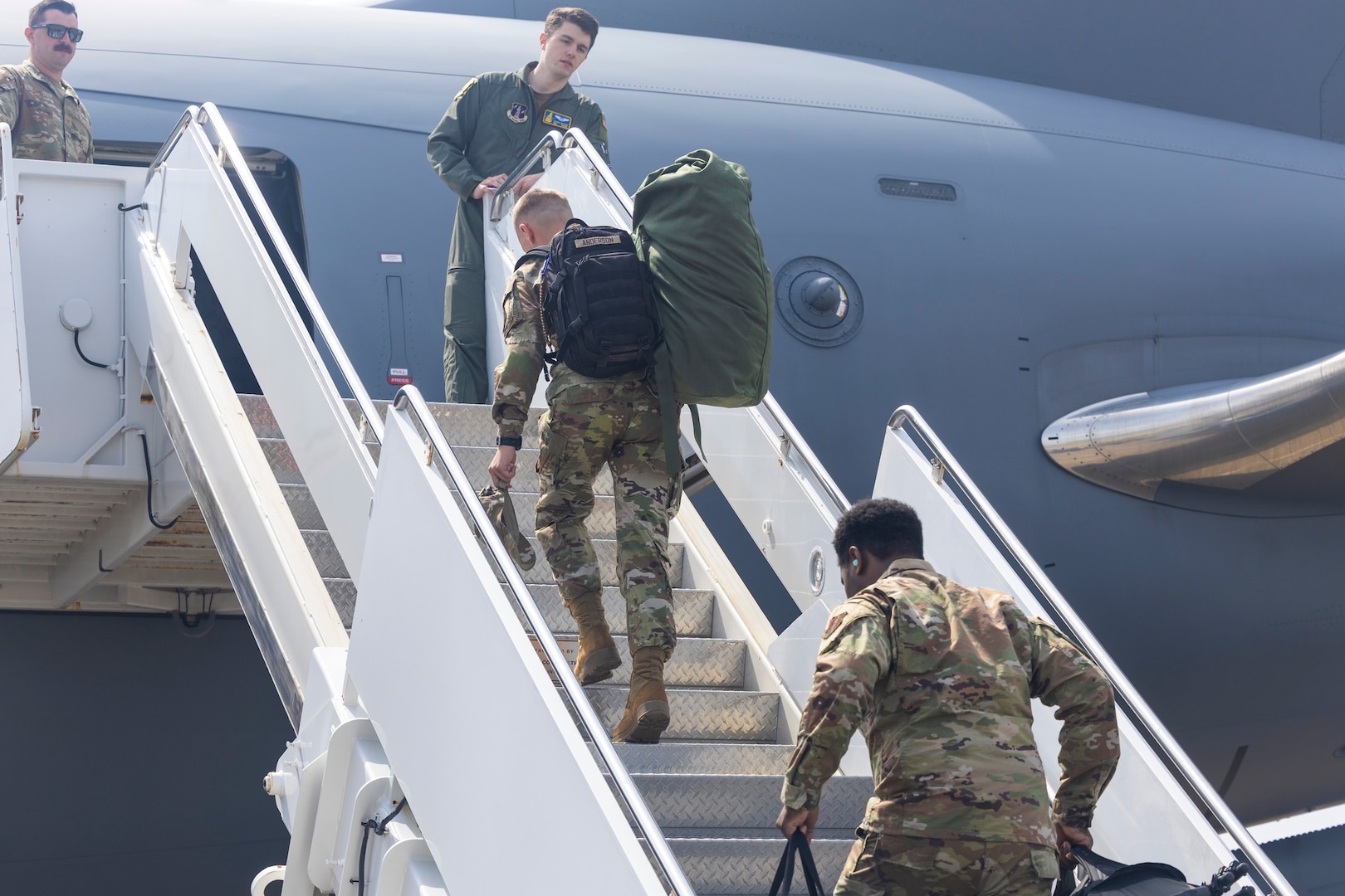 Members assigned to the 192nd Wing board the flight departing for Operation Maverick's Armistice at Joint Base Langley-Eustis, Apr 21, 2025.