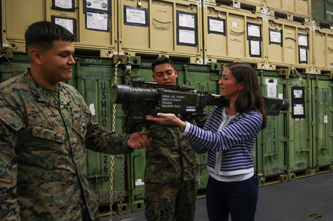 Ms. Eliza Lundy, Military Legislative Assistant to Sen. Cindy Hyde-Smith, receives a demonstration of a FIM 92A stinger missile from U.S. Marines with Low Altitude Air Defense (LAAD), Marine Medium Tiltrotor Squadron 263 (Reinforced), 22nd Marine Expeditionary Unit, during a tour of the Wasp-class amphibious assault ship USS Iwo Jima (LHD 7), Iwo Jima Amphibious Readiness Group, during a staff delegation visit while underway in the Atlantic Ocean, April 5, 2025. The visit showcased the capabilities of the embarked 22nd Marine Expeditionary Unit as part of the IWOARG/22MEU team, illustrating the strategic importance of amphibious shipping for projecting power and rapidly responding to global crises. The delegation's visit aboard LHD 7 during Amphibious Squadron 8 (PHIBRON 8), 22nd MEU Integration (PMINT) exercise enabled dialogue between the staff members and Navy and Marine Corps personnel, deepening their understanding of the ARG/MEU's diverse mission sets and underscoring their indispensable role in achieving national security objectives. (U.S. Marine Corps photo by Cpl. Sharon Ruiz)