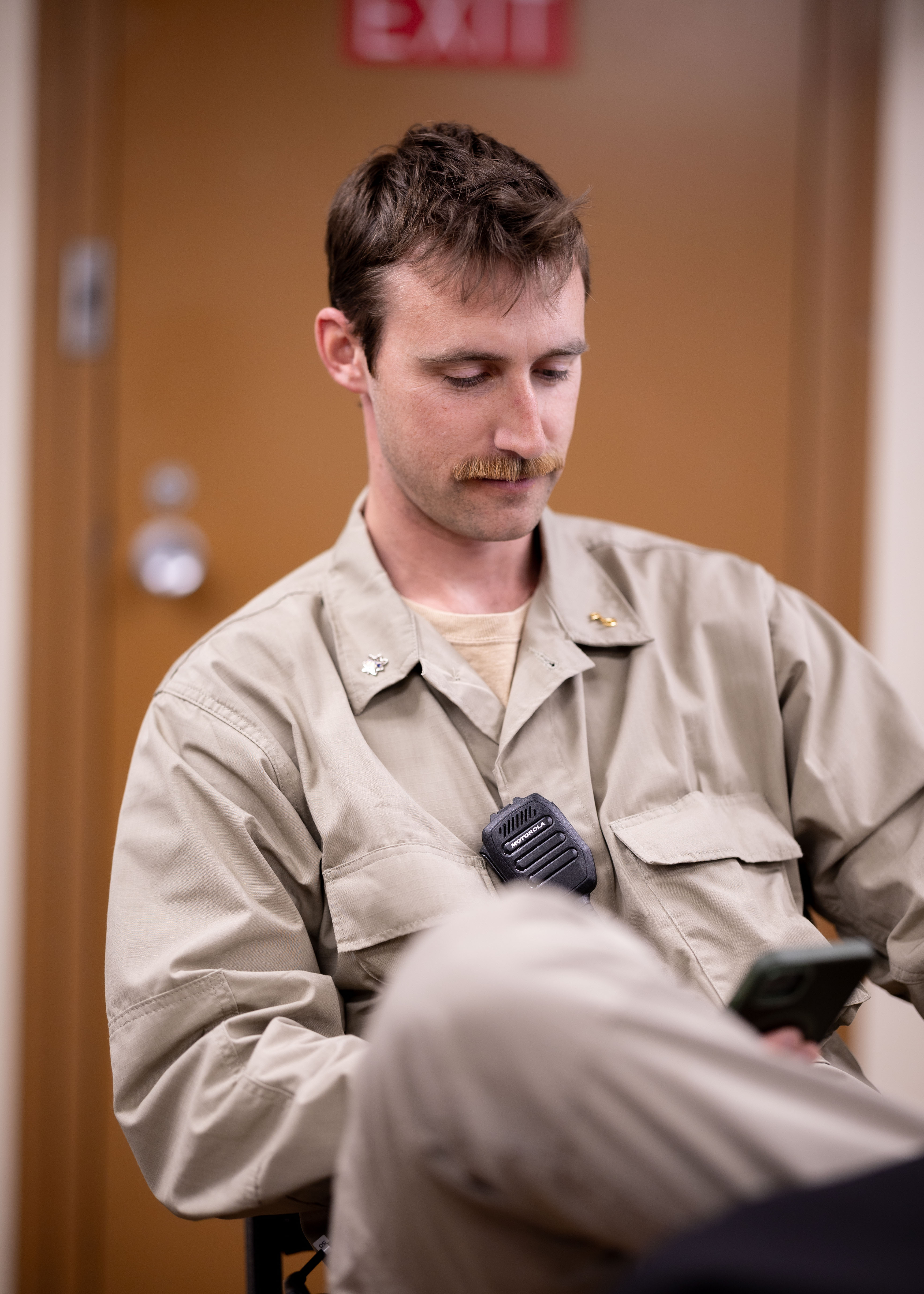 Miles Farver, Chief Mate, USNS Joshua Humphreys (T-AO 188), sends emails wirelessly from his personal phone thanks to the Starshield system installed aboard the ship, which provides 5G connectivity, April 16, 2025.