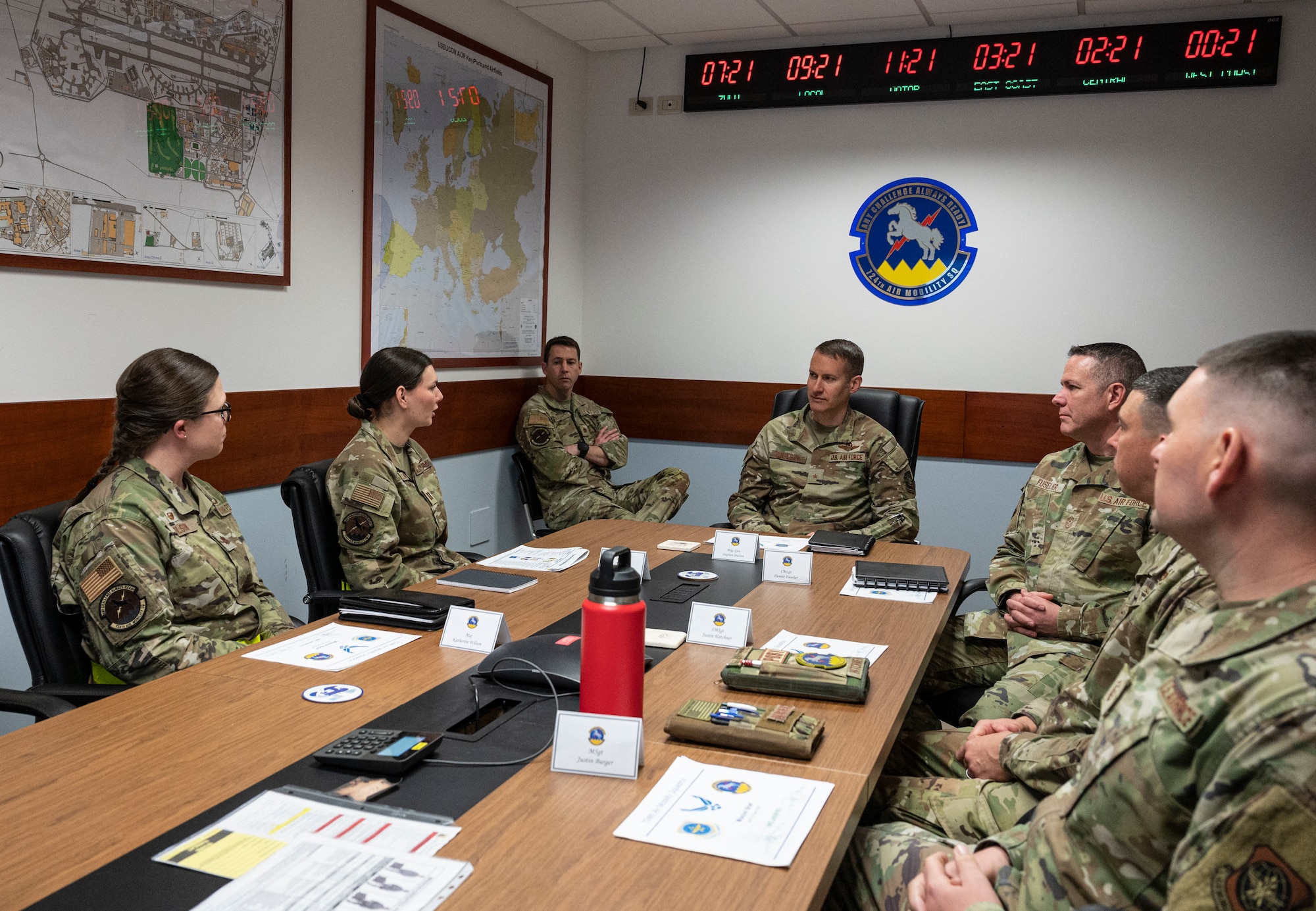 Airmen at briefing table