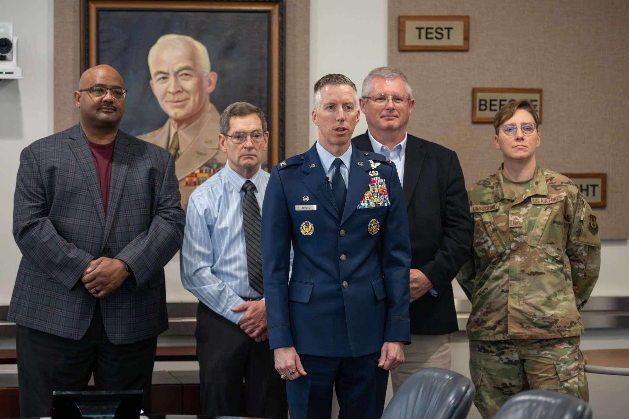 Arnold Engineering Development Complex Commander Col. Grant Mizell, center, is joined by AEDC leadership and the heads of the Integrated Prevention and Response and Sexual Assault Prevention and Response offices at Arnold Air Force Base, Tenn., as he records a message for members of the AEDC workforce following the March 28, 2025, signing of a proclamation recognizing April as Sexual Assault Awareness and Prevention Month across AEDC. In his message, Mizell urged members of Team AEDC to stand with sexual assault survivors and challenge a culture that has allowed sexual violence to exist. Pictured with Mizell, from left, are Integrated Prevention and Response Director Lee Smith, AEDC Deputy Director Kevin Muckerheide, Sexual Assault Response Coordinator Gary Johnson and AEDC Senior Enlisted Leader Chief Master Sgt. Jennifer Cirricione. Arnold AFB is the headquarters of AEDC. (U.S. Air Force photo by Keith Thornburgh)