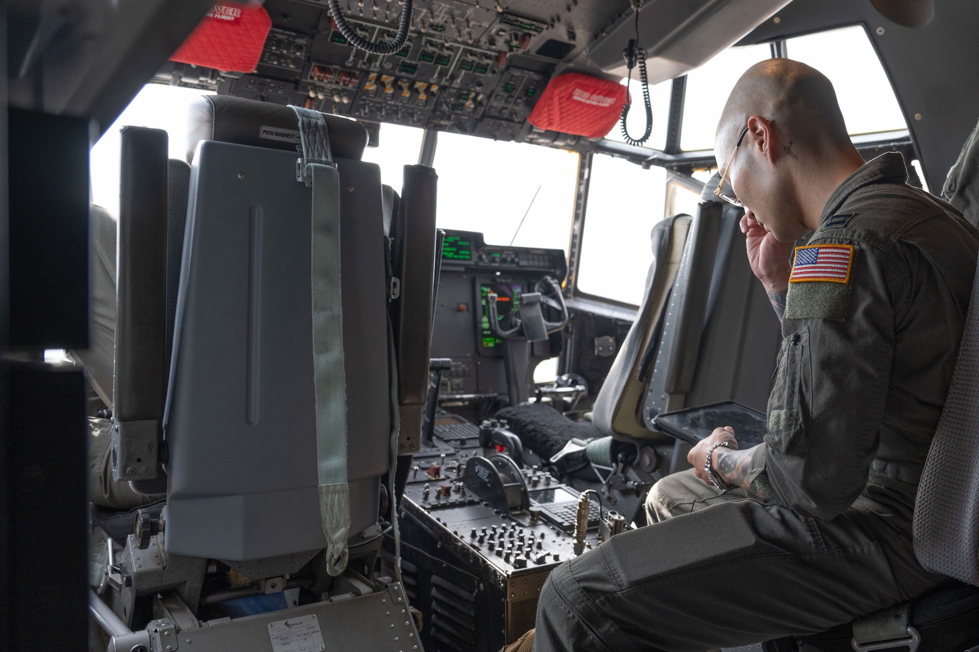 A pilot with the 39th Airlift Squadron uses an electronic flight bag as he prepares for a Max Endurance Operation enroute to support Exercise Balikatan 25 at Dyess Air Force Base, Texas, April 17, 2025. Balikatan is a longstanding annual exercise between the Armed Forces of the Philippines and U.S. military designed to strengthen our ironclad alliance, improve our capable combined force, and demonstrate our commitment to regional security and stability. (U.S. Air Force photo by Airman Caleb Schellenberg)
