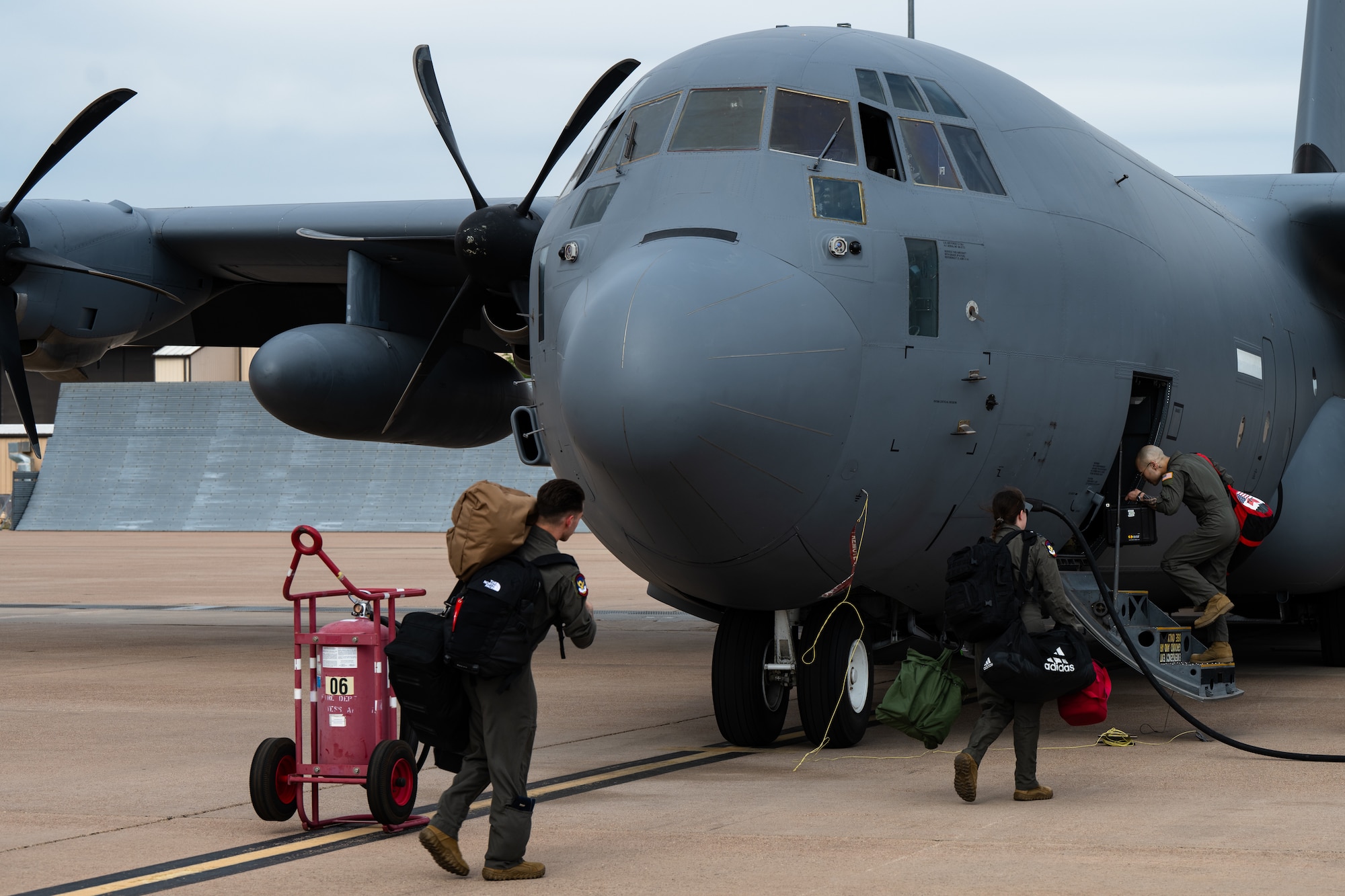 Pilots with the 39th Airlift Squadron step to a C-130J Super Hercules equipped with external fuel tanks ahead of a Max Endurance Operation enroute to support Exercise Balikatan 25 at Dyess Air Force Base, Texas, April 17, 2025. Balikatan is a longstanding annual exercise between the Armed Forces of the Philippines and U.S. military designed to strengthen our ironclad alliance, improve our capable combined force, and demonstrate our commitment to regional security and stability. (U.S. Air Force photo by Airman 1st Class Jade M. Caldwell)