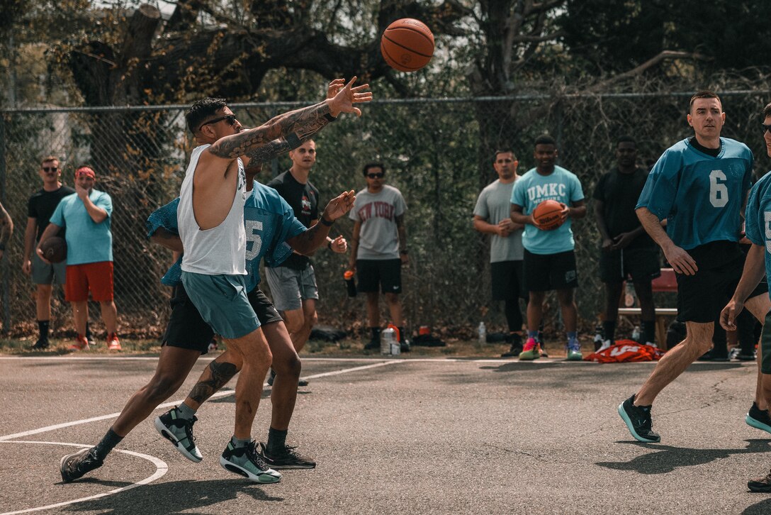 U.S. Marines with Security Battalion play a game of basketball during a basketball tournament at Marine Corps Base Quantico, Virginia, April 18, 2025. The event gave the battalion an opportunity to build comradery through friendly competition. (U.S. Marine Corps photo by Lance Cpl. Ethan Miller)