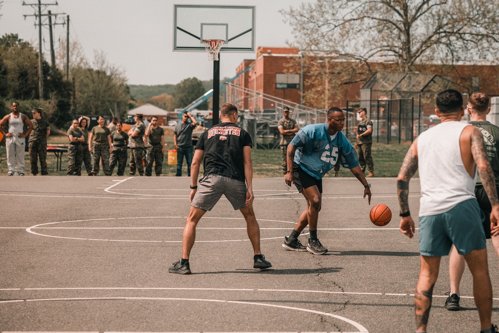 U.S. Marines with Security Battalion play a game of basketball during a basketball tournament at Marine Corps Base Quantico, Virginia, April 18, 2025. The event gave the battalion an opportunity to build comradery through friendly competition. (U.S. Marine Corps photo by Lance Cpl. Ethan Miller)