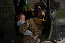 Team Minot families get a tour of a UH-1N Iroquois at Minot Air Force Base, North Dakota, April 18, 2025. Families were given the opportunity to tour the base in honor of the Month of the Military Child. (U.S. Air Force photo by Senior Airman Alyssa Bankston)