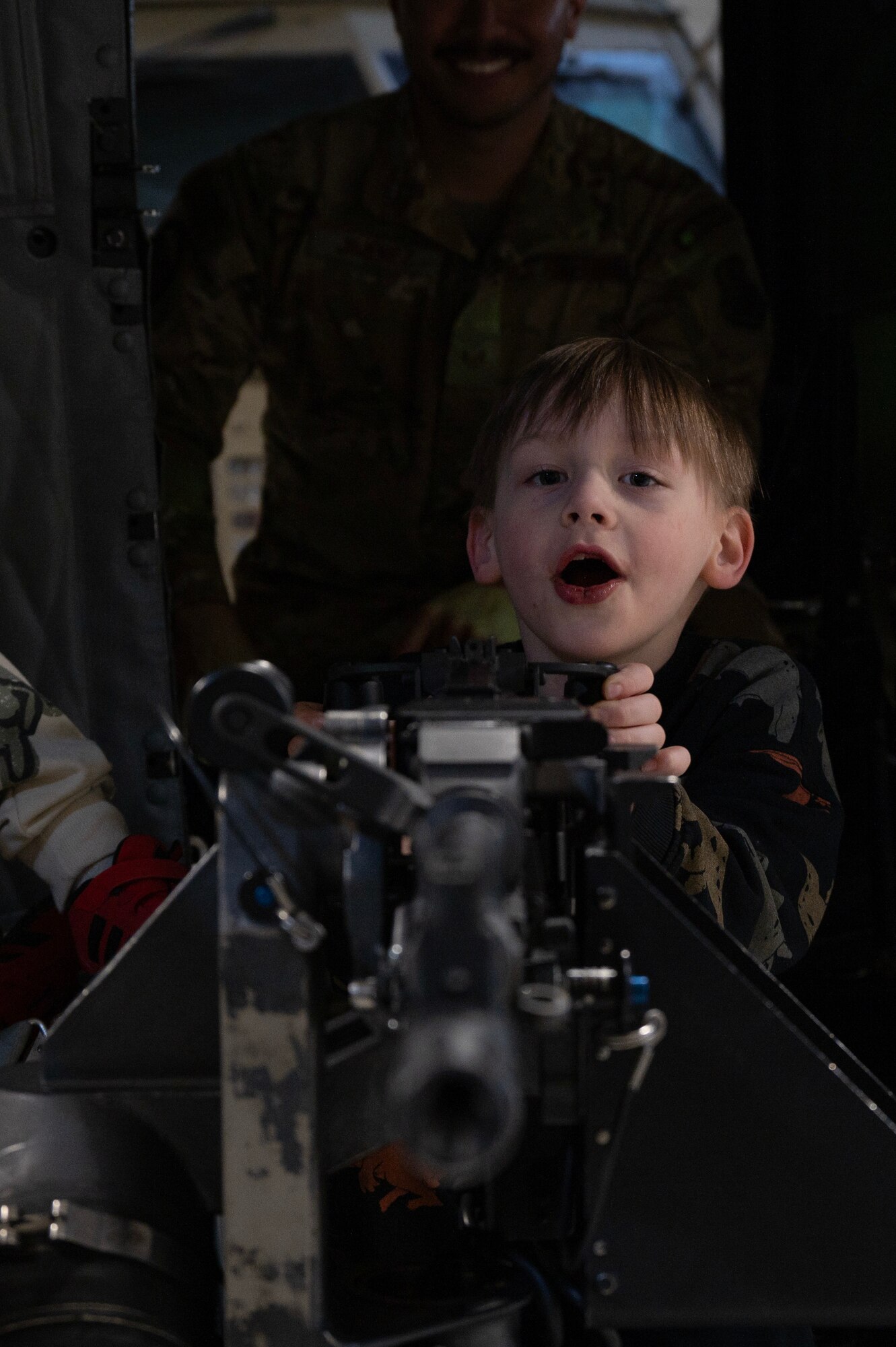 Team Minot families get a tour of a UH-1N Iroquois at Minot Air Force Base, North Dakota, April 18, 2025. The 91st Security Forces Group hosted the tour in honor of the Month of the Military Child. (U.S. Air Force photo by Senior Airman Alyssa Bankston)