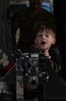 Team Minot families get a tour of a UH-1N Iroquois at Minot Air Force Base, North Dakota, April 18, 2025. The 91st Security Forces Group hosted the tour in honor of the Month of the Military Child. (U.S. Air Force photo by Senior Airman Alyssa Bankston)