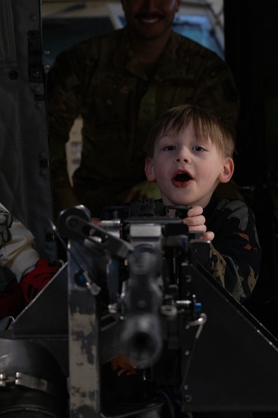 Team Minot families get a tour of a UH-1N Iroquois at Minot Air Force Base, North Dakota, April 18, 2025. The 91st Security Forces Group hosted the tour in honor of the Month of the Military Child. (U.S. Air Force photo by Senior Airman Alyssa Bankston)
