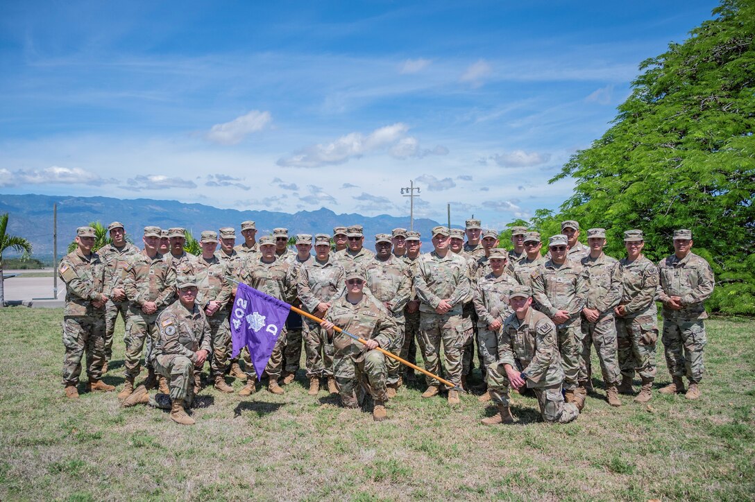 32 new Civil Affairs team members pose for a group photo prior to shipping to their operating locations.