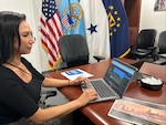 Women works on laptop on conference room.