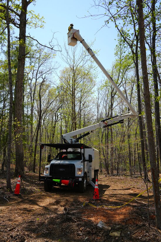 Contractors working under the direction of the U.S. Army Corps of Engineers clear storm debris from Hurricane Helene at the Boy Scouts of America's Camp Grimes in McDowell County, North Carolina, April 18, 2025. The removal effort is part of a FEMA-assigned mission to assist with private property debris removal. The work is helping prepare the 1,100-acre Boy Scout camp to reopen for summer programs.