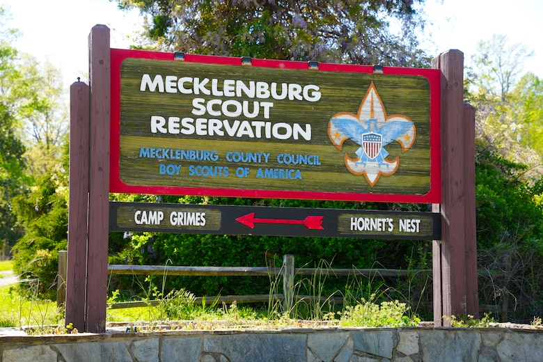 A sign welcomes visitors to Camp Grimes in McDowell County, North Carolina, April 18, 2025. The 1,100-acre Boy Scout camp is undergoing debris removal as part of a FEMA-assigned mission led by the U.S. Army Corps of Engineers following Hurricane Helene. Crews are working to help the camp reopen in time for summer programs.