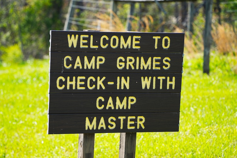 A sign welcomes visitors to Camp Grimes in McDowell County, North Carolina, April 18, 2025. The 1,100-acre Boy Scout camp is undergoing debris removal as part of a FEMA-assigned mission led by the U.S. Army Corps of Engineers following Hurricane Helene. Crews are working to help the camp reopen in time for summer programs.
