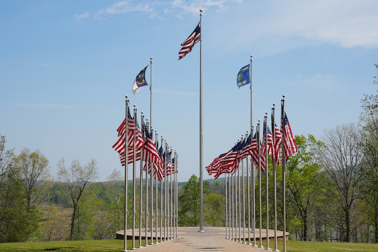 Twenty-five American flags, along with the North Carolina state flag and the Boy Scouts of America flag, fly in formation near the dining facility overlooking Camp Grimes in McDowell County, North Carolina, April 18, 2025. The U.S. Army Corps of Engineers is supporting debris removal at the 1,100-acre Boy Scout camp as part of a FEMA-assigned mission following Hurricane Helene.