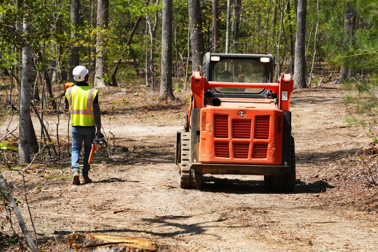 Contractors working under the direction of the U.S. Army Corps of Engineers clear storm debris from Hurricane Helene at the Boy Scouts of America's Camp Grimes in McDowell County, North Carolina, April 18, 2025. The removal effort is part of a FEMA-assigned mission to assist with private property debris removal. The work is helping prepare the 1,100-acre Boy Scout camp to reopen for summer programs.