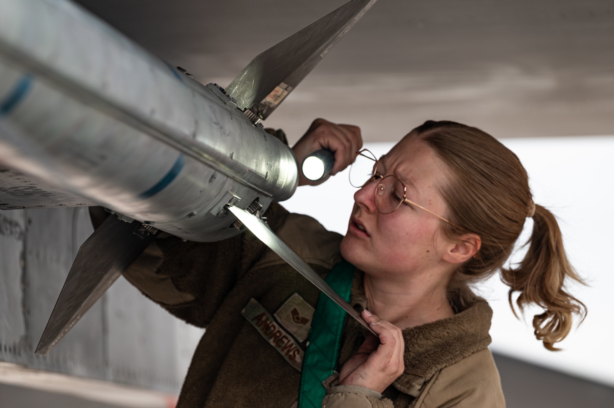 Women inspecting missle