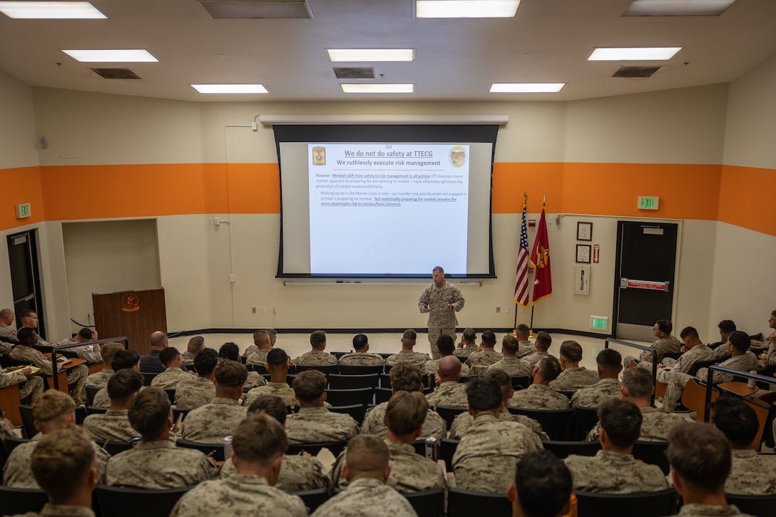 U.S. Marine Corps Col. David Hart, a New Hampshire native, director of Tactical Training and Exercise Control Group, Marine Air-Ground Task Force Training Command, Marine Corps Air-Ground Combat Center, gives the opening remarks during a welcome aboard brief at MCAGCC, Twentynine Palms, California, April 1, 2025. The welcome aboard brief prepares units for the upcoming training exercises by addressing risk mitigation and small unit leadership. Employing modern learning methods and a student-centered approach, TTECG is committed to sharpening individual skills and fostering confidence in the face of 21st-century modern warfare complexities. (U.S. Marine Corps photo by Lance Cpl. Indiana Supensky)