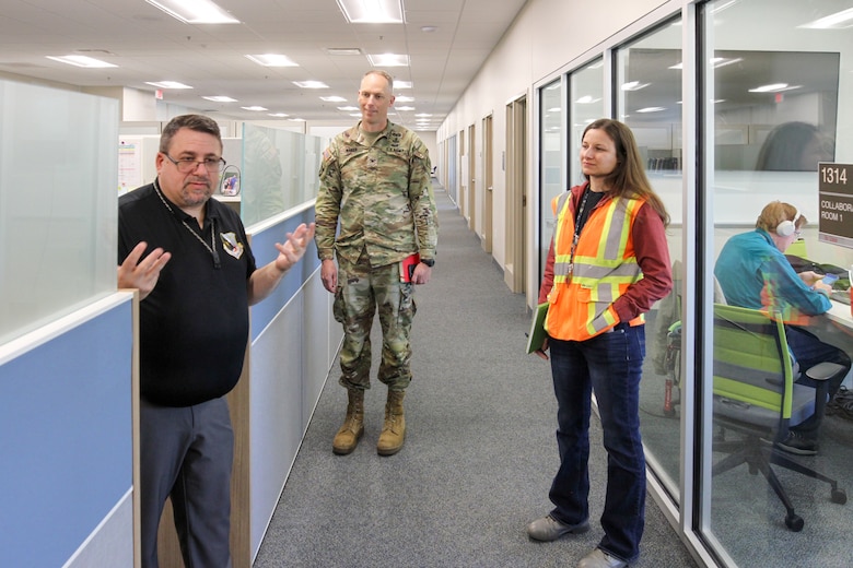 Jason Bostjancic, 412th Test Engineering Group deputy director, left, briefs Col. Andrew Baker, U.S. Army Corps of Engineers Los Angeles District commander, center, about the office portion of the Flight Test Engineering Laboratory during Baker’s April 3 visit to Edwards Air Force Base, California. The LA District designed and constructed the two-story, 75,000-square-foot laboratory, engineering and office complex for the Air Force.