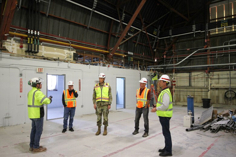 A contractor, left, briefs Col. Andrew Baker, U.S. Army Corps of Engineers Los Angeles District commander, center, during Baker’s April 3 visit to Plant 42 near Edwards Air Force Base, California, to see construction progress on the Bldg. 531 Rehabilitation Project.