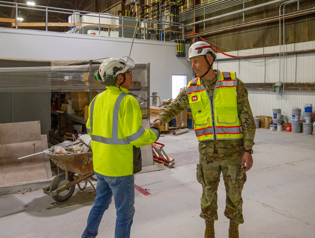 Col. Andrew Baker, U.S. Army Corps of Engineers Los Angeles District commander, right, greets a contractor during his April 3 visit to Plant 42 near Edwards Air Force Base, California, to see construction progress on the Bldg. 531 Rehabilitation Project.