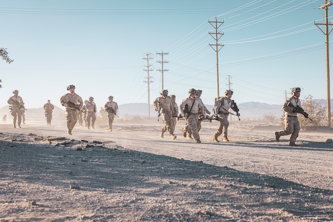 U.S. Marines with 3rd Battalion, 1st Marine Regiment, 1st Marine Division, conduct battle skills tests on Ripper Run during a 1st Marine Division Squad Competition at Marine Corps Air-Ground Combat Center, Twentynine Palms, California, March 18, 2025. The squad competition was designed to take one squad from 1st Light Armored Reconnaissance Battalion, 3rd LAR Battalion and each infantry regiment to compete in a series of events that evaluate physical fitness, basic infantry skills, tactical knowledge, casualty care, marksmanship, small unmanned aerial system utilization, and offensive and defensive operations. (U.S. Marine Corps Photo by Lance Cpl. Enge You)