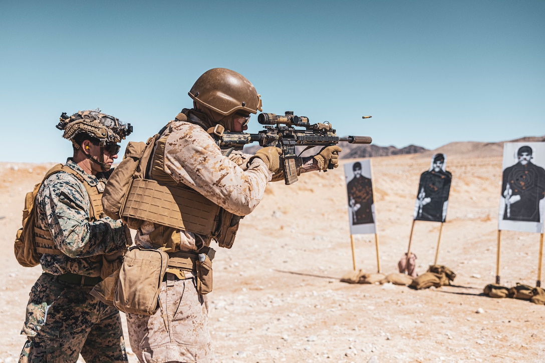U.S. Marine Corp Cpl. Tanner Mitchell, a Missouri native, infantry Marine with 3rd Battalion, 1st Marine Regiment, 1st Marine Division, right, conducts marksmanship assessment in the standing position during the 1st Marine Division Squad Competition, at Range 105A, Marine Corps Air-Ground Combat Center, Twentynine Palms, California, March 18, 2025. The squad competition was designed to take one squad from 1st Light Armored Reconnaissance Battalion, 3rd LAR Battalion and each infantry regiment to compete in a series of events that evaluate physical fitness, basic infantry skills, tactical knowledge, casualty care, marksmanship, small unmanned aerial system utilization, and offensive and defensive operations. (U.S. Marine Corps Photo by Lance Cpl. Enge You)