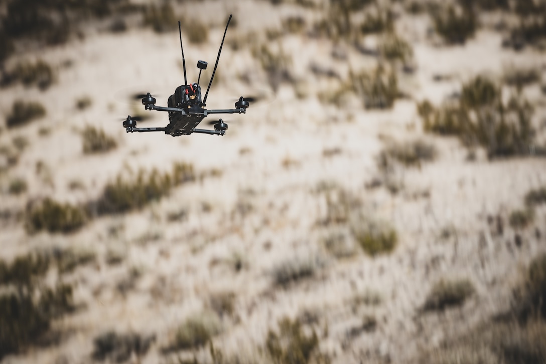 An N1 Archer drone flies during a showcase at Range 220, Marine Corps Air-Ground Combat Center, Twentynine Palms, California, March 12, 2025. The N1 Archer is the first FPV platform built to deliver modular warheads on the BlueUAS list authorized for official Department of Defense use. The sUAS showcase provided joint service members the opportunity to explore the N1 Archer’s controls and capabilities. (U.S. Marine Corps photo by Lance Cpl. Richard PerezGarcia)