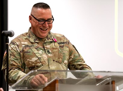 Sgt. 1st Class Britt Talley shares a smile while addressing attendees during his retirement ceremony April 18 at Camp Lincoln in Springfield, Illinois. Talley expressed gratitude to his family, mentors, and fellow Soldiers as he closed out 31 years of service in the Illinois Army National Guard.
(U.S. Army photo by 2nd Lt. Trenton Fouche, Joint Force Headquarters – Illinois National Guard)