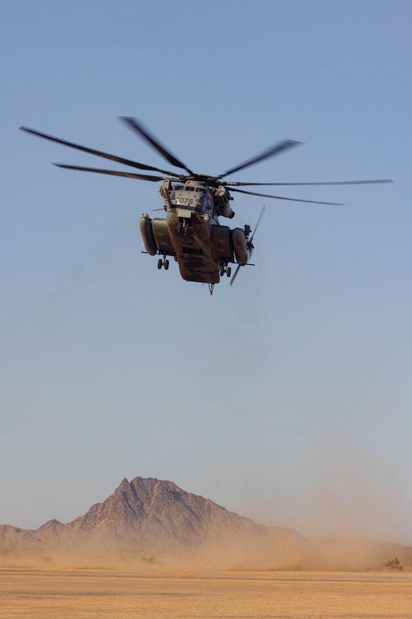 U.S. Marine Corps CH-53E Super Stallion pilots assigned to Marine Aviation Weapons and Tactics Squadron One (MAWTS-1), land during Assault Support Tactics 2 as part of Weapons and Tactics Instructor course 2-25, at Landing Zone Hawkeye, near Wellton, Arizona, April 16, 2025. AST-2 is a daytime, force-on-force event which affords prospective weapons and tactics instructors the opportunity to plan, brief, and execute a company-reinforced air assault while integrating the six functions of Marine Aviation. (U.S. Marine Corps photo by Lance Cpl. Fabian Ortiz)