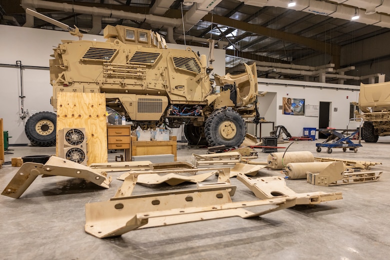 A military vehicle is prepared for installation service in a U.S. Army Corps of Engineers Expeditionary District constructed Tactical Equipment Maintenance Facility, in the U.S. Central Command area of operations.