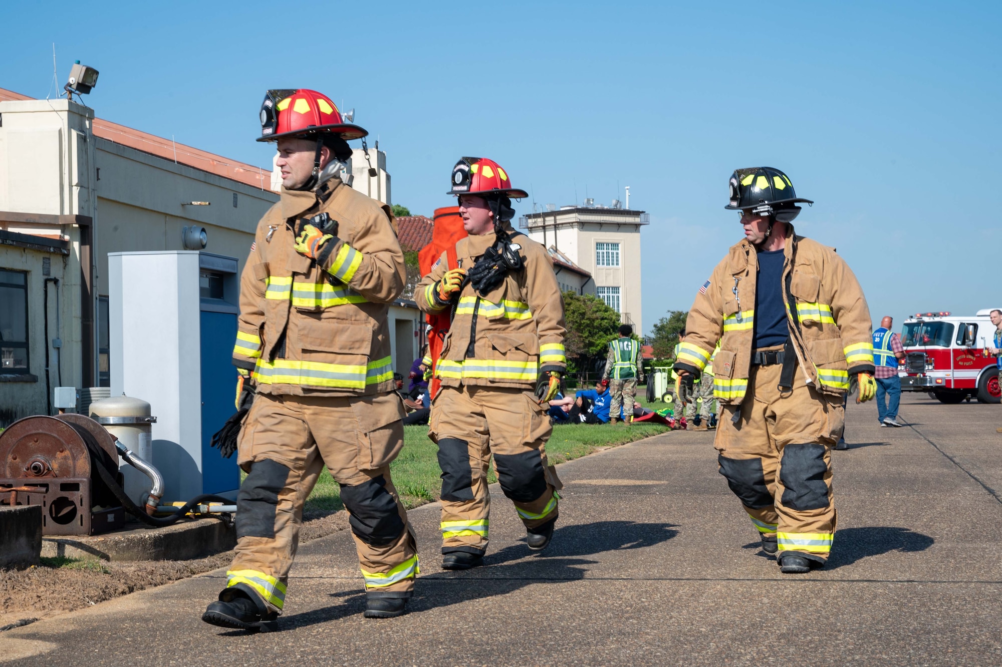 From left, Thomas Stewart, 42nd Civil Engineer Squadron firefighter, Tyler Locke, 42nd CES vehicle driver, and Mike Hill, 42nd CES firefighter run checks through a scene during a MAXFORCE exercise simulating an aircraft mishap at Maxwell Air Force Base, Alabama, April 17, 2025.