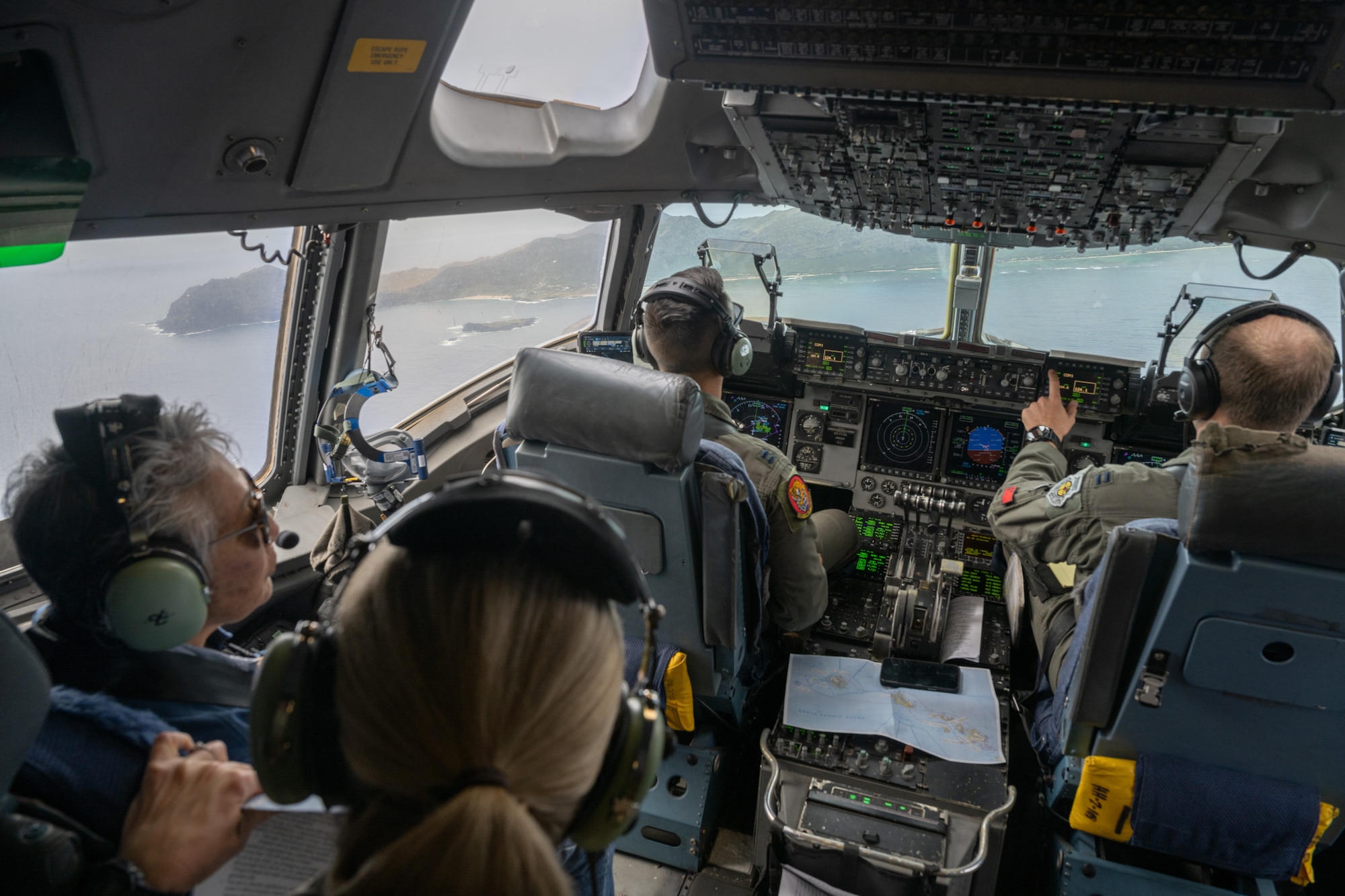Dawn Chang, Hawaiʻi Department of Land and Natural Resources Chairwoman, left, speaks with U.S. Air Force Lt. Gen. Laura Lenderman, Pacific Air Forces deputy commander, during a flight on a C-17 Globemaster III, from Joint Base Pearl Harbor-Hickam, during a mission off the coast of the state of Hawaiʻi, April 17, 2025. The flight showcased the importance of the Air Force and Space Force mission in Hawaiʻi and its critical role to ensure stability and security in the Indo-Pacific. (U.S. Air Force photo by Tech. Sgt. Emerson Nuñez)