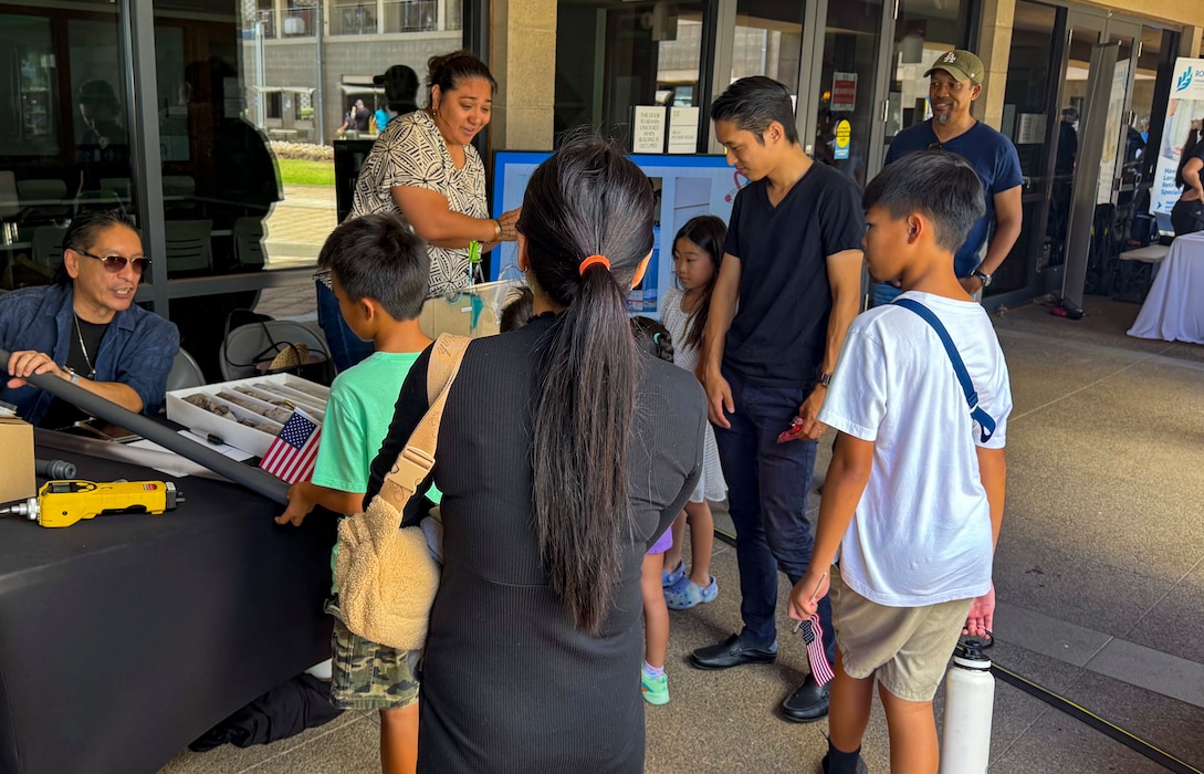 KAPOLEI, Hawaii (April 5, 2025) Mario Maningas, physical scientist, Navy Closure Task Force-Red Hill (NCTF-RH) and Tiffany Iiga-Saole, deputy assistant regional engineer, Commander, Navy Region Hawaii (CNRH),  speak with guests at the ninth annual Onizuka Day of Exploration held at the University of Hawaii-West Oahu in Kapolei, Hawaii, April 5, 2025. The local science, technology, engineering and mathematics (STEM) event provided an opportunity for the local community to engage with NCTF-RH and CNRH members to learn about STEM-related operations as part of their mission to safely close the Red Hill Bulk Fuel Storage Facility.  (U.S. Navy photo by Lt. Naadia Puri)