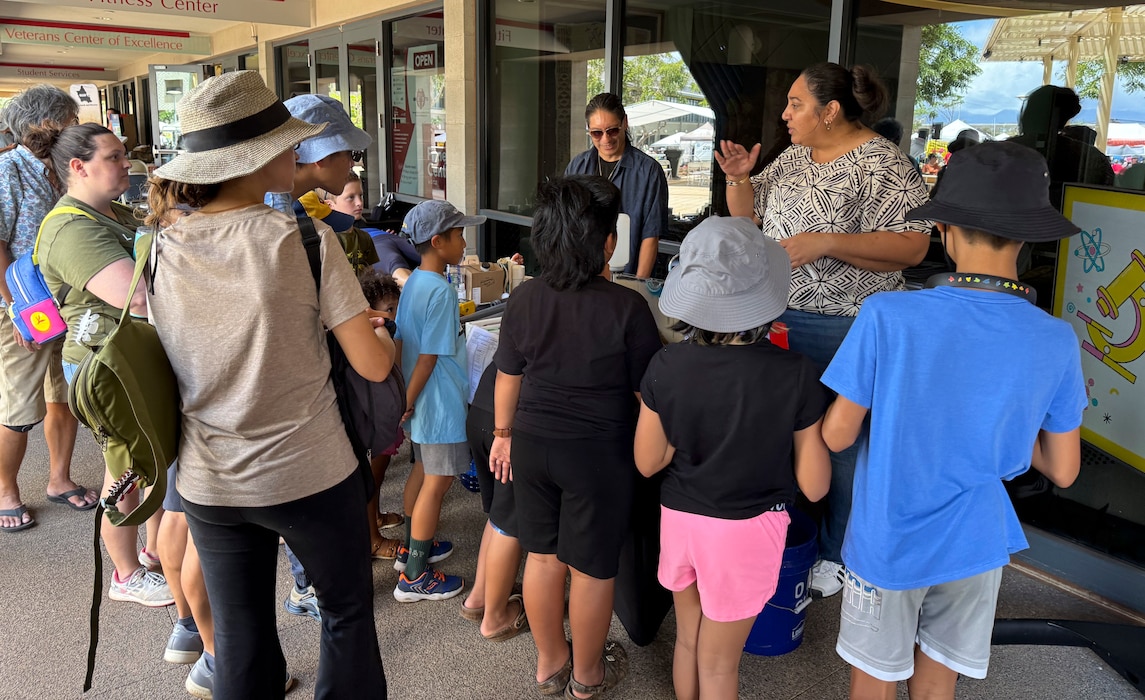 KAPOLEI, Hawaii (April 5, 2025) Mario Maningas, physical scientist, Navy Closure Task Force-Red Hill (NCTF-RH) and Tiffany Iiga-Saole, deputy assistant regional engineer, Commander, Navy Region Hawaii (CNRH), speak with guests at the ninth annual Onizuka Day of Exploration held at the University of Hawaii-West Oahu in Kapolei, Hawaii, April 5, 2025. The local science, technology, engineering and mathematics (STEM) event provided an opportunity for the local community to engage with NCTF-RH and CNRH members to learn about NCTF-RH STEM-related operations as part of their mission to safely close the Red Hill Bulk Fuel Storage Facility. (U.S. Navy photo by Lt. Naadia Puri)