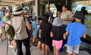 KAPOLEI, Hawaii (April 5, 2025) Mario Maningas, physical scientist, Navy Closure Task Force-Red Hill (NCTF-RH) and Tiffany Iiga-Saole, deputy assistant regional engineer, Commander, Navy Region Hawaii (CNRH), speak with guests at the ninth annual Onizuka Day of Exploration held at the University of Hawaii-West Oahu in Kapolei, Hawaii, April 5, 2025. The local science, technology, engineering and mathematics (STEM) event provided an opportunity for the local community to engage with NCTF-RH and CNRH members to learn about NCTF-RH STEM-related operations as part of their mission to safely close the Red Hill Bulk Fuel Storage Facility. (U.S. Navy photo by Lt. Naadia Puri)