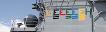 USS America proudly displays a newly painted golden “E” with a silver star above it, symbolizing its fifth consecutive Battle Effectiveness Award. USS America earned the Battle “E” Award every year she was forward-deployed to U.S. Naval Forces in Japan.