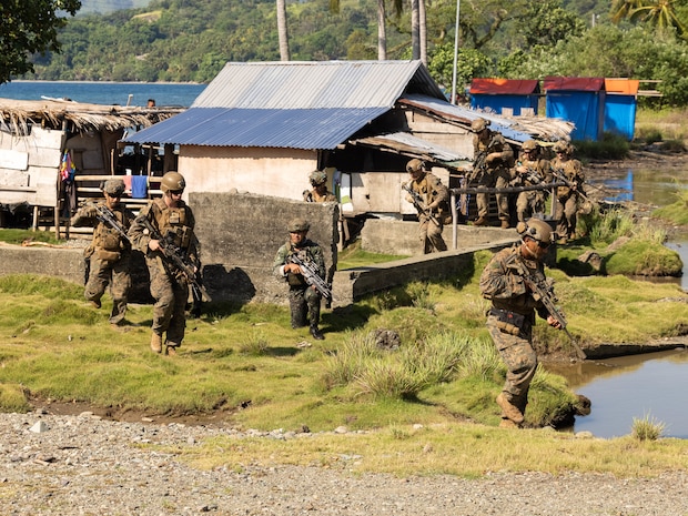 Philippine Reconnaissance Marines with 1st Marine Brigade and U.S. Marines with Echo Company, 2nd Battalion, 1st Marine Regiment, Marine Rotational Force – Darwin 25.3 move to their objective during an amphibious assault demonstration rehearsal as part of Marine Exercise 2025 near Cotabato City, Mindanao, Philippines, April 8, 2025.