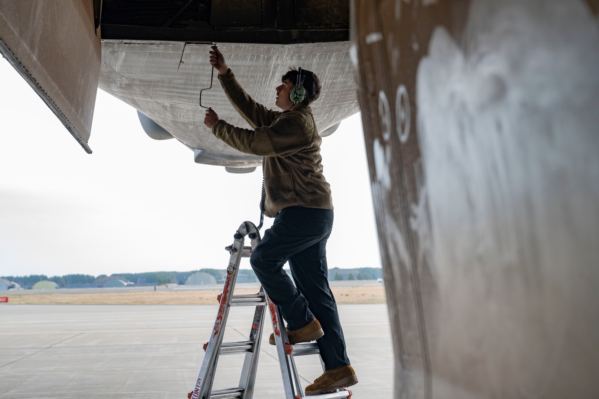U.S. Air Force Senior Airman Jonathan Byles, 9th Expeditionary Bomb Squadron crew chief, performs post-flight maintenance at Misawa Air Base, Japan, in support of Bomber Task Force 25-2, April 18, 2025. Strategic bomber task force missions enhance the readiness and training necessary to respond to any potential crisis or challenge across the globe. (U.S. Air Force photo by Senior Airman Emma Anderson)