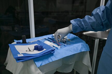 A Guyanese surgical technician prepares a sterile tray before an eye procedure at Georgetown Public Hospital, Georgetown, Guyana, April 3, 2025 during LAMAT 2025.
