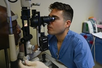 U.S. Army Maj. Halward Blegen, Brooke Army Medical Center refractive eye surgeon, assesses a patient at Georgetown Public Hospital, Georgetown, Guyana, April 3, 2025 during the Lesser Antilles Medical Assistance Team (LAMAT) 2025.