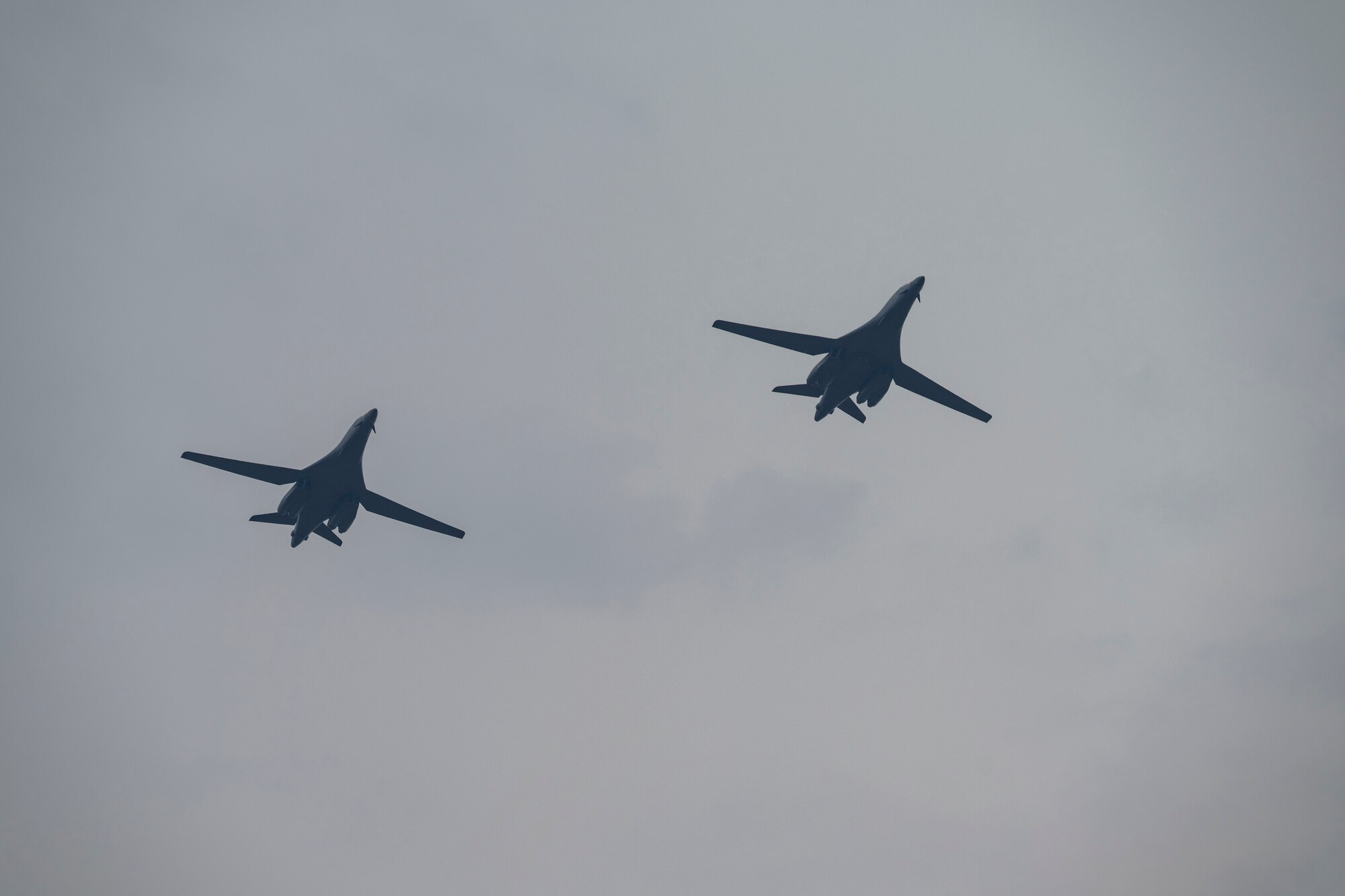 B-1B Lancers assigned to Dyess Air Force Base, Texas, fly over Misawa Air Base, Japan, in support of Bomber Task Force 25-2, April 18, 2025. USSTRATCOM Bomber Task Force missions help maintain global stability and security by demonstrating the ability to operate in different environments and locations while building Ally and partner military capabilities. (U.S. Air Force photo by Senior Airman Emma Anderson)