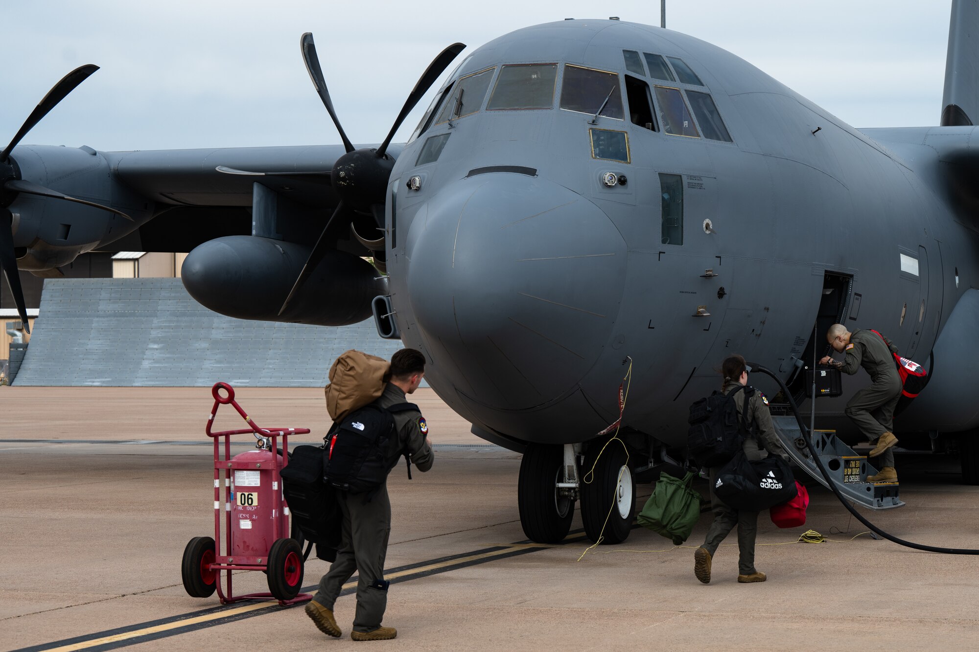 Pilots with the 39th Airlift Squadron step to a C-130J Super Hercules equipped with external fuel tanks ahead of a Max Endurance Operation enroute to support Exercise Balikatan 25 at Dyess Air Force Base, Texas, April 17, 2025. Balikatan is a longstanding annual exercise between the Armed Forces of the Philippines and U.S. military designed to strengthen our ironclad alliance, improve our capable combined force, and demonstrate our commitment to regional security and stability. (U.S. Air Force photo by Airman 1st Class Jade M. Caldwell)