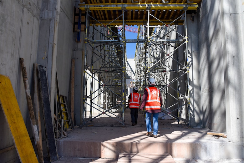 two USACE employees walking through construction zone