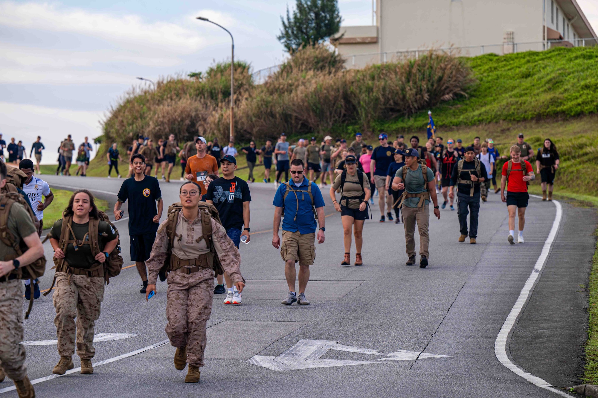 Service members run in the Bataan March.