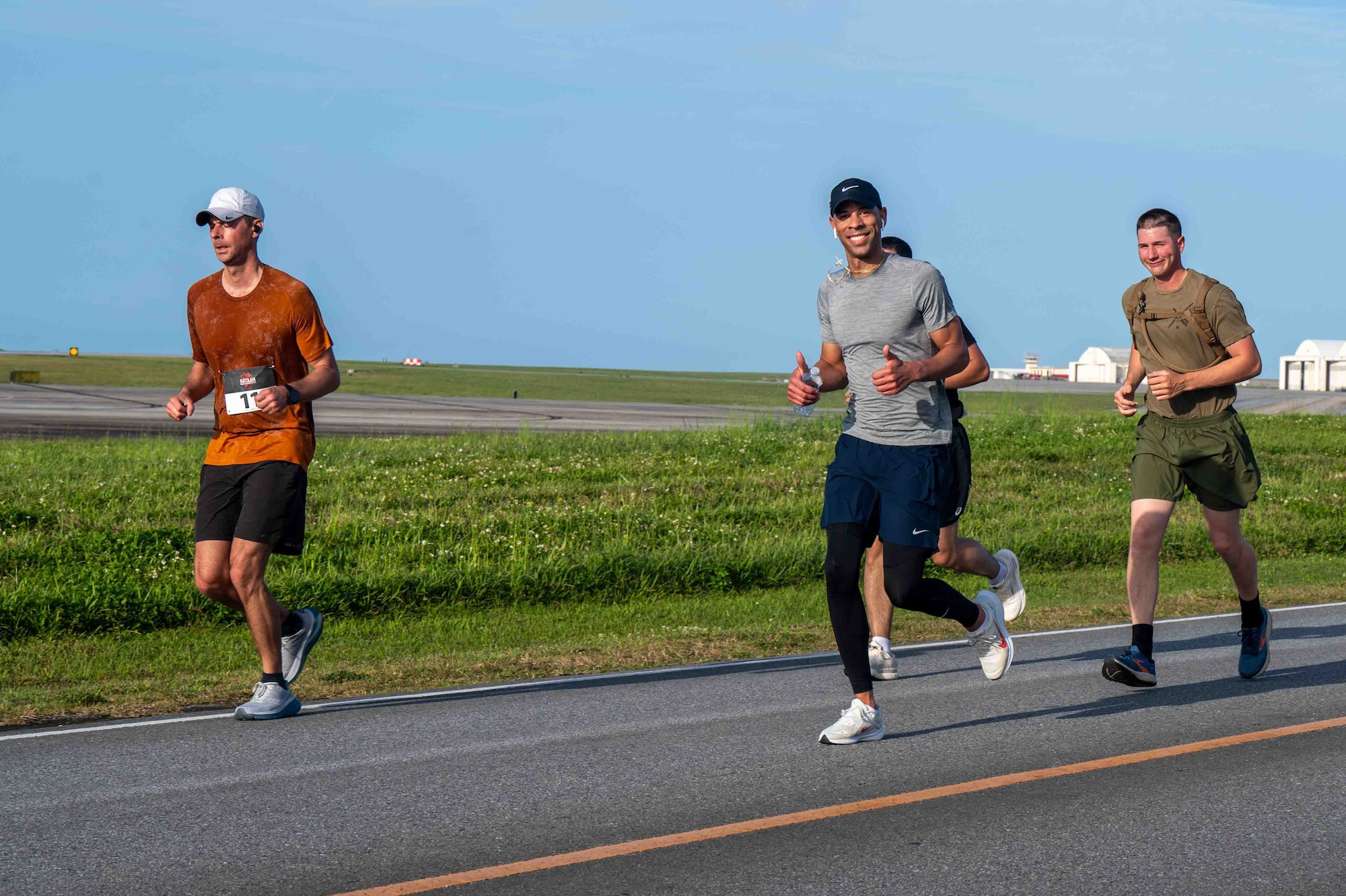 Service members run in the Bataan March.