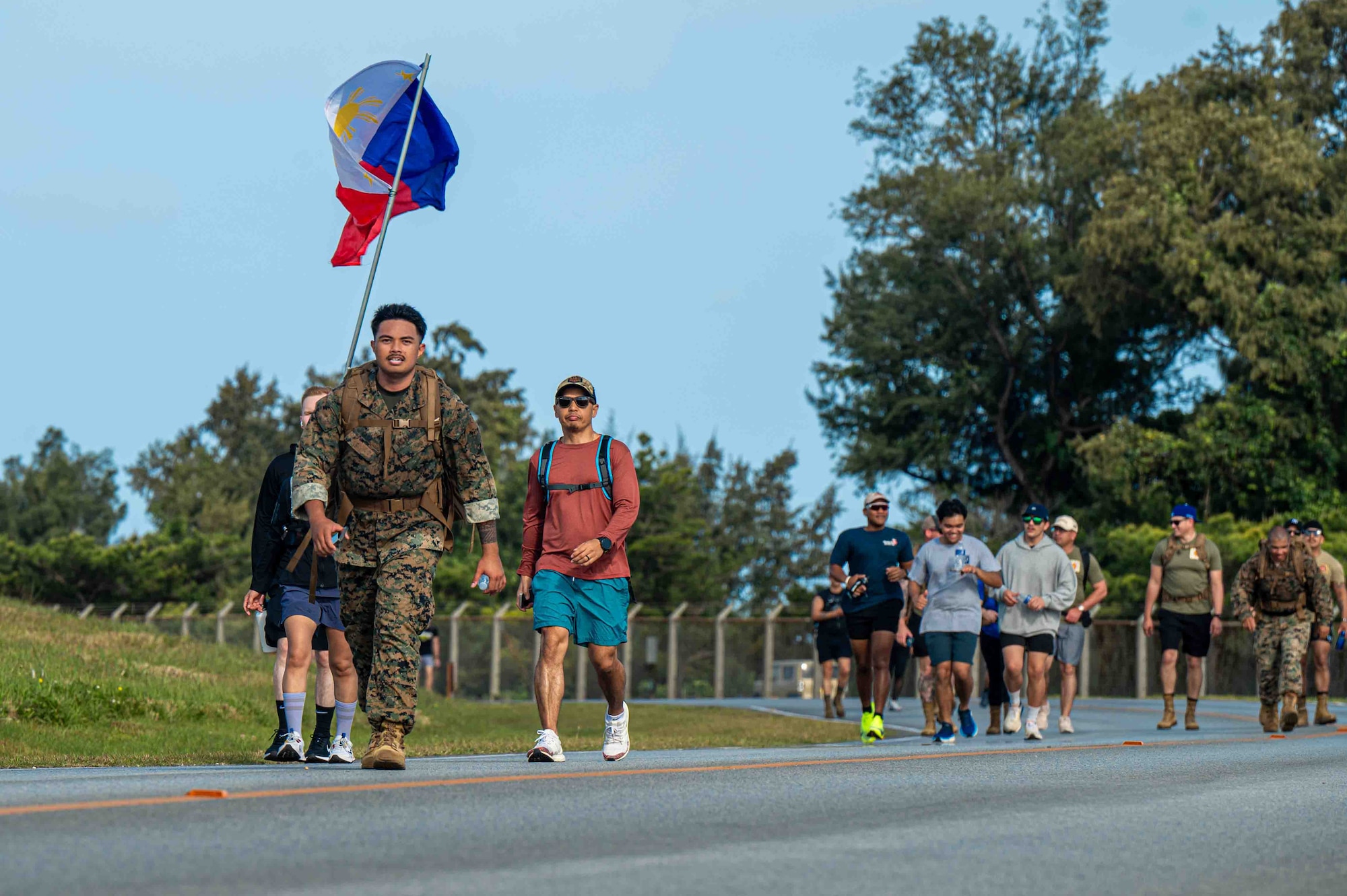 Service members run in the Bataan March.
